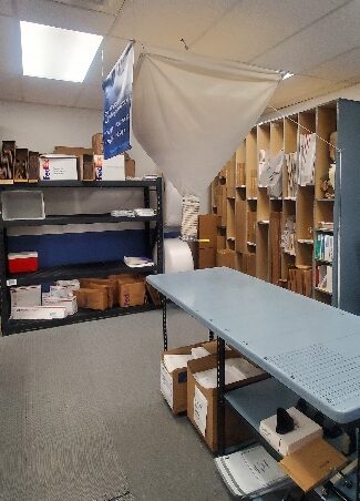 Packing supplies area at Star MailHub and More in Roanoke, showing shelves of boxes, mailers, and packing materials.