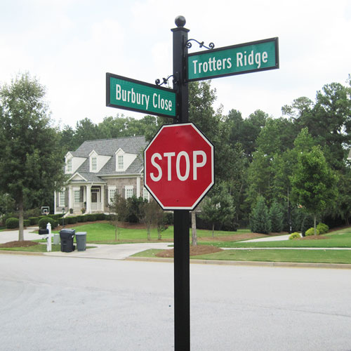 Coordinated HOA street-name and stop-sign post system.