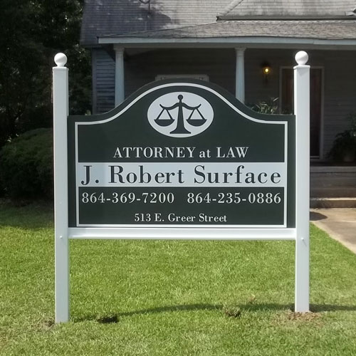 Permanent business sign installed in a substantial framed sign system.